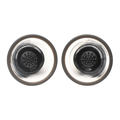 Pair of clear and black rotating silicone nipple suckers with textured inner attachments for stimulation.