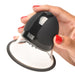 Hand holding Size Matters rotating silicone nipple sucker with clear cup and black top button control.