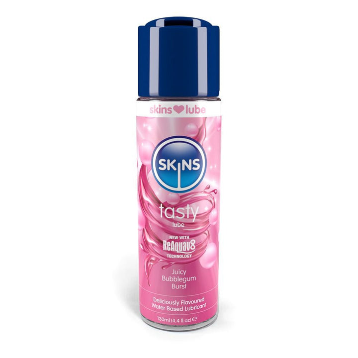 Skins tasty lube bottle in pink with blue cap, juicy bubblegum burst flavored water-based lubricant, 4.4 oz size.