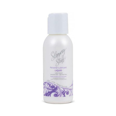 Bottle of Slippery Stuff Liquid water-based personal lubricant with purple decorative design on white background.