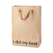 Brown kraft gift bag with brown ribbon handles and the phrase I did my best printed on the front bottom.