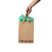 Hand holding a kraft gift bag with brown ribbon handles and green tissue paper, printed with "I did my best" text.