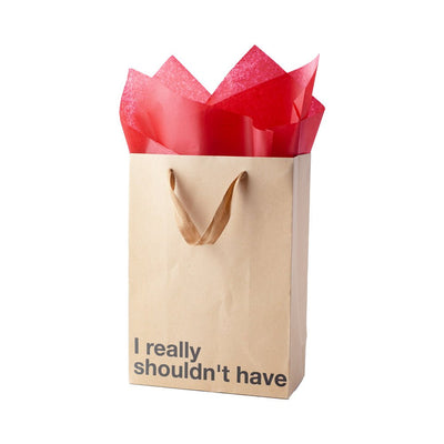 Kraft gift bag with brown ribbon handles and red tissue paper, printed with "I really shouldn't have" in bold text.