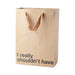 Kraft paper gift bag with brown ribbon handles and "I really shouldn't have" printed in black text.