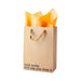 Kraft gift bag with brown ribbon handles and orange tissue paper, printed with "Just smile and say you love it" text.