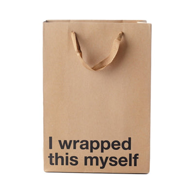 Kraft paper gift bag with brown ribbon handles and bold black text reading I wrapped this myself on front.