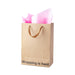 Kraft gift bag with brown ribbon handles and pink tissue paper, printed with "Wrapping is hard" text at the bottom.