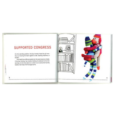 Open book showing a playful Kama Sutra pose with colorful sock monkeys and a black-and-white bookshelf illustration.
