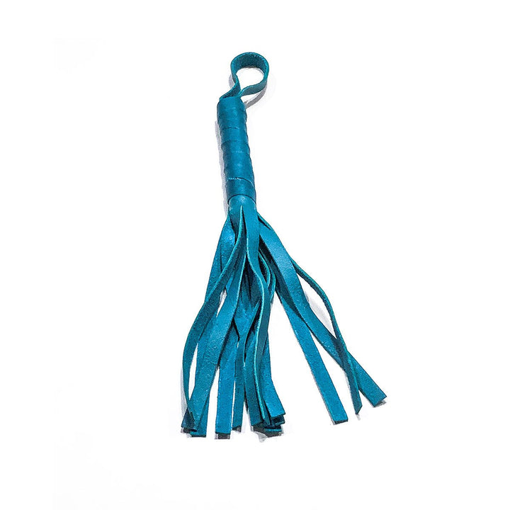 Aqua blue soft leather flogger with multiple strips and a looped handle for easy grip.