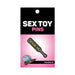 Gray enamel paddle pin with gold "Spank Me" text on pink and black Wood Rocket packaging.