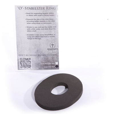 Black large Spareparts base stabilizer ring with product information card in the background on a white surface.