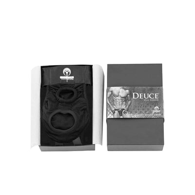 SpareParts Deuce Male Harness in black, neatly packaged in a box with branded sleeve featuring a muscular male model.