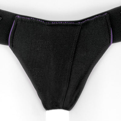 Close-up of Spareparts Joque Cover double-strap underwear harness in black nylon with purple trim and breathable fabric.