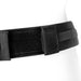Close-up of black adjustable double strap nylon harness belt with Velcro closure on white mannequin waist.