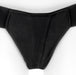Black nylon single-strap thong-style underwear harness with reinforced stitching and breathable fabric panel.