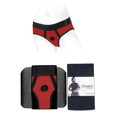Red and black Spareparts Tomboi nylon briefs harness displayed on a mannequin and folded in packaging with product label.