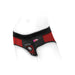 Red and black nylon brief harness with O-ring and mini-vibe pockets, designed for comfort and versatility.