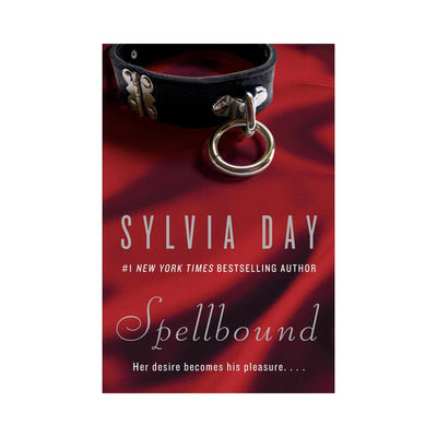 Book cover of Spellbound by Sylvia Day featuring a black leather collar with a metal ring on red satin fabric background.