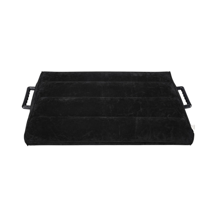 Black inflatable wedge positioner with soft velvet coating and sturdy side handles for support and stability.