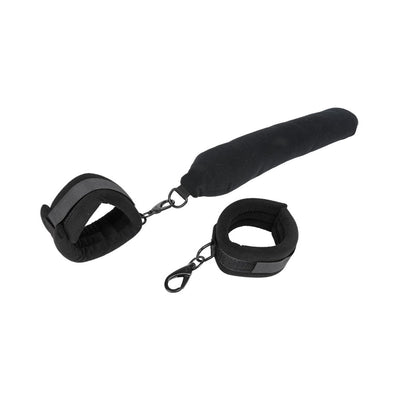 Black padded flexible positioning bar with two adjustable cuffs and metal clips for secure attachment.