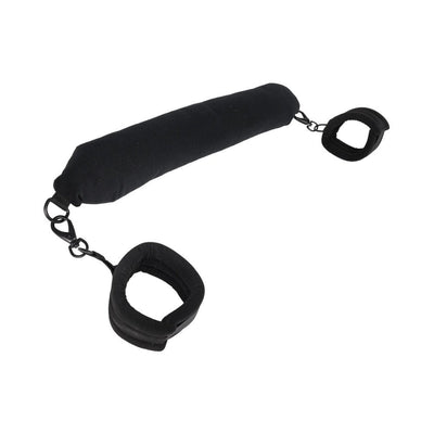 Black padded flexible positioning bar with attached soft cuffs and metal clips for adjustable support and restraint.