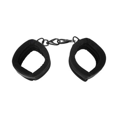 Black padded adjustable cuffs connected by metal clasps for versatile positioning and restraint.