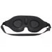 Black memory foam blindfold with contoured eye and nose divots and adjustable elastic strap for a comfortable fit.