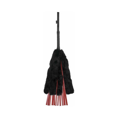 Black faux fur flogger with red faux leather strands and a wrapped handle with wrist strap.