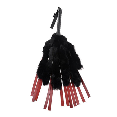 Black faux fur and red faux leather flogger with wrapped handle and wrist strap.