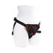 Adjustable black strap-on harness with red lining and a curved black silicone dildo on a white mannequin.