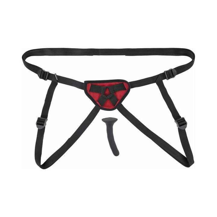 Black adjustable strap-on harness with red padded front panel and a slim black silicone dildo on white background.