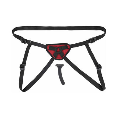 Black adjustable strap-on harness with red padded front panel and a slim black silicone dildo on white background.
