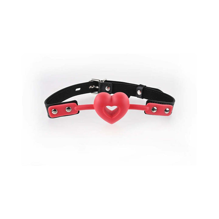 Red heart-shaped breathable ball gag with adjustable black strap and silver buckle hardware.