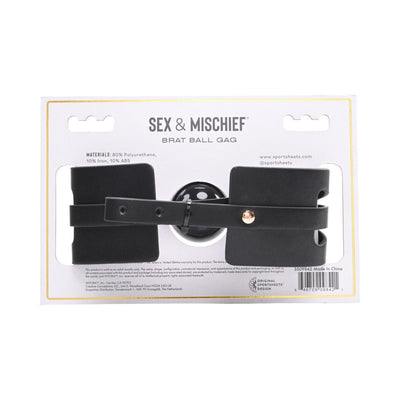Sportsheets Sex & Mischief Brat Ball Gag in black faux leather with adjustable strap on white packaging.