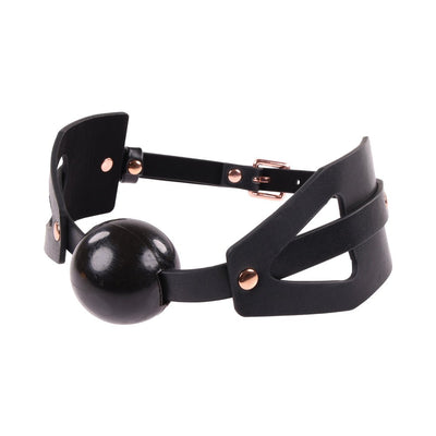 Black faux leather ball gag with adjustable strap and rose gold hardware, featuring a smooth silicone ball for comfort.