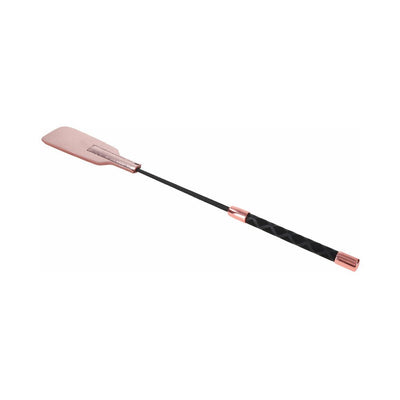 Rose gold vegan leather brat crop with black textured handle and split tip for impact play.