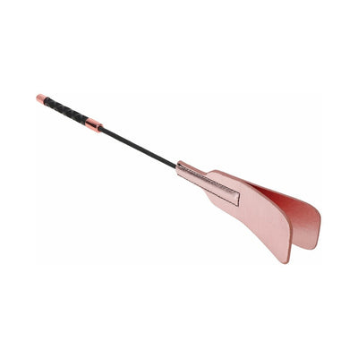 Rose gold vegan leather brat crop with split tip and black textured handle for grip, designed for impact play.
