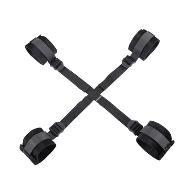 Black adjustable Sportsheets Sex & Mischief Brat Hog Tie with four padded cuffs connected by straps.