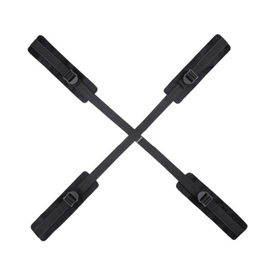 Black adjustable Sportsheets Sex & Mischief Brat Hog Tie with four padded cuffs connected by straps.