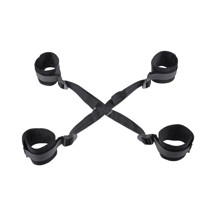 Black adjustable Sportsheets Sex & Mischief Brat Hog Tie with four soft cuffs connected by straps.