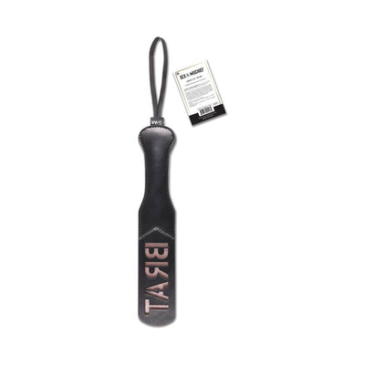 Black faux leather paddle with wrist loop and the word BRAT embossed on the striking surface, featuring a product tag.