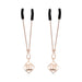 Rose gold adjustable nipple clips with black rubber tips and decorative faux pearl charms in geometric frames.