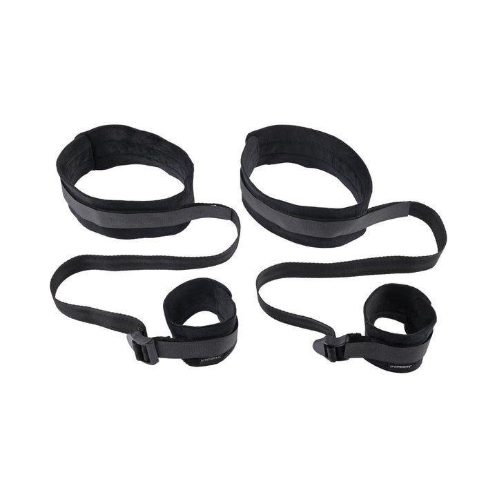 Black adjustable thigh and wrist cuffs connected by straps designed for comfortable restraint play.