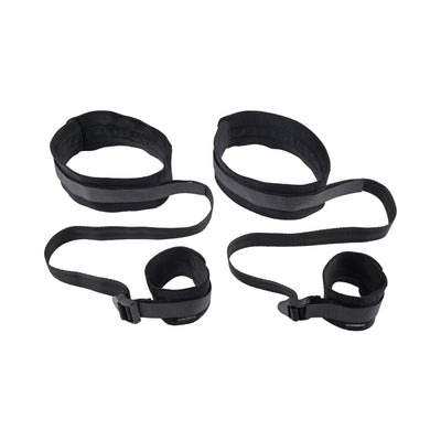 Black adjustable thigh and wrist cuffs connected by straps designed for comfortable restraint play.