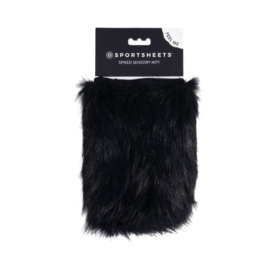 Black faux fur sensory mitt with hidden spikes by Sportsheets in retail packaging.