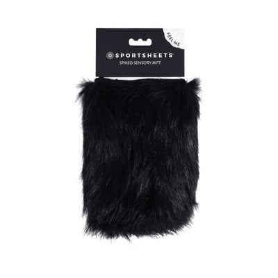 Black faux fur sensory mitt with hidden spikes, packaged with Sportsheets branding and a feel-me label.