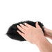 Hands demonstrating the black faux fur Sportsheets Spiked Sensory Mitt with one visible metal spike on a white background.