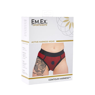 Packaging of Em.Ex Contour Harness in red and black, showing front view of harness worn on model with tattooed thigh.
