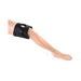 Black neoprene adjustable thigh strap-on harness displayed on a mannequin leg against a white background.