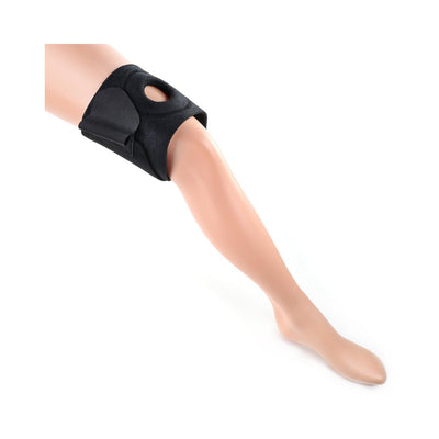 Black neoprene thigh strap-on harness with adjustable hook and loop closure displayed on a mannequin leg.